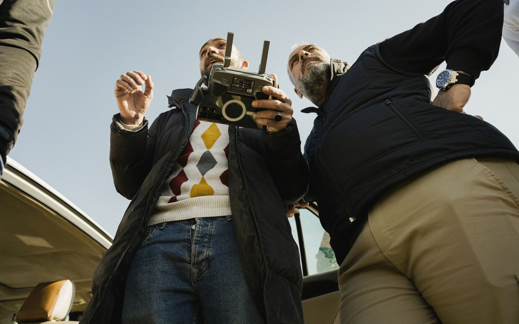 Drone operators coordinating an outdoor flight